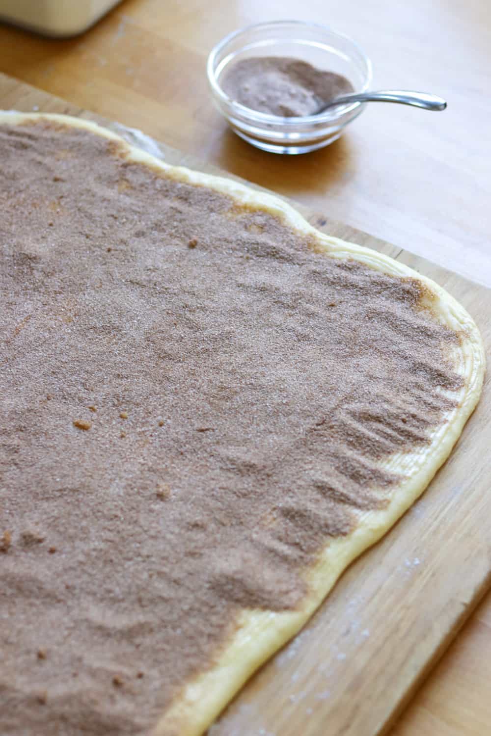 Cinnamon sugar mixture on top of dough.