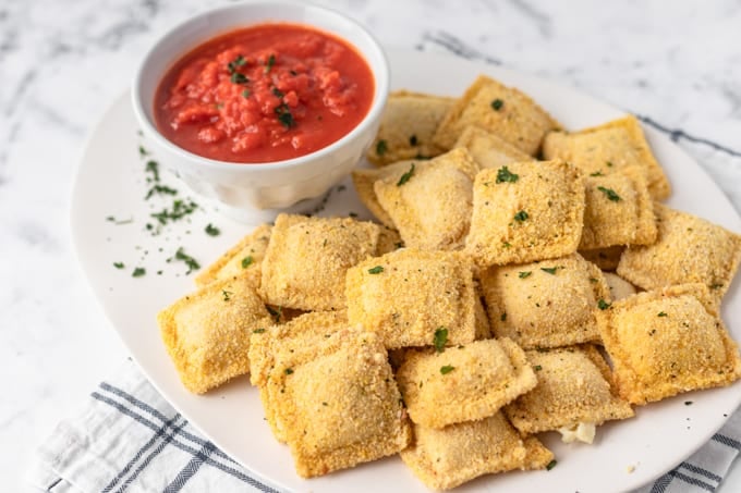 Crispy breaded ravioli for an appetizer with marinara.