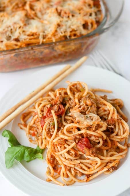 A plate of spaghetti with meat sauce baked in the oven.