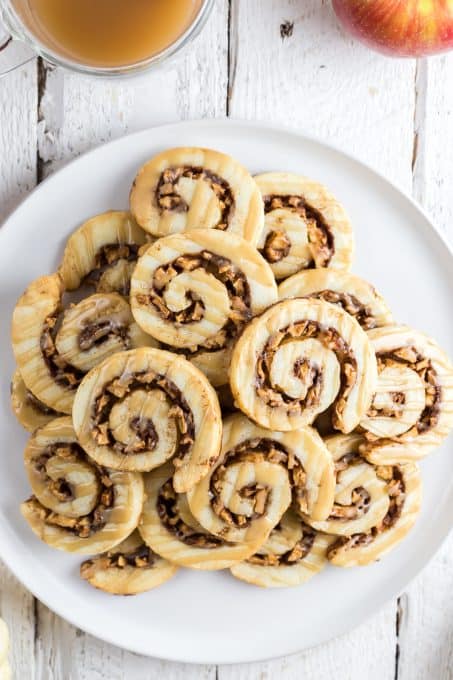 A plate of apple pie cookies glazed with caramel.