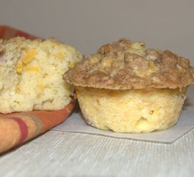 These Peach Streusel Muffins with fresh peaches and cinnamon streusel topping are a great addition to any summer breakfast, ladies brunch or bridal shower!