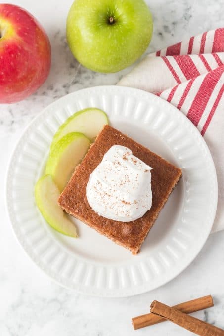 Top view of a cake with fresh whipped cream.