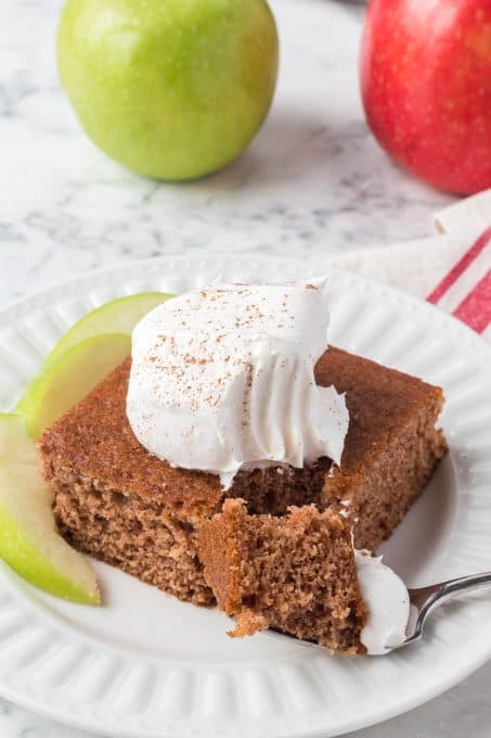 A bite taken out of a cake made with applesauce.