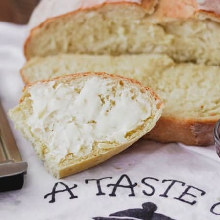 Buttered slice of Grandma's Italian Bread.