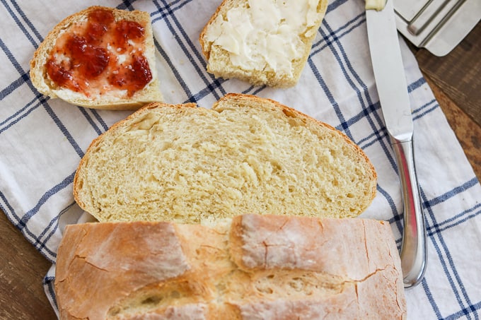 A loaf of Grandma's Italian Bread with two slices.