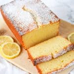 Sliced Lemon Ricotta Pound Cake on a cutting board.