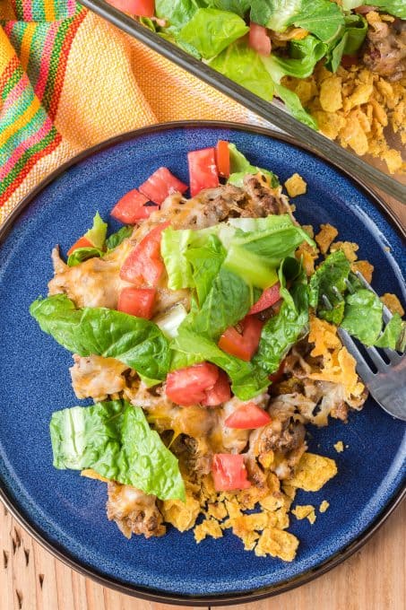 Fritos, taco beef, lettuce, tomatoes and cheese make up this easy dinner casserole.