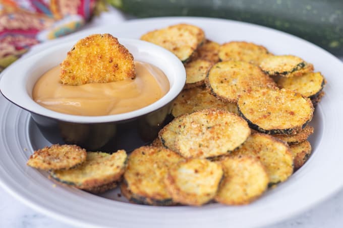 A plate of breaded and air fried zucchini.
