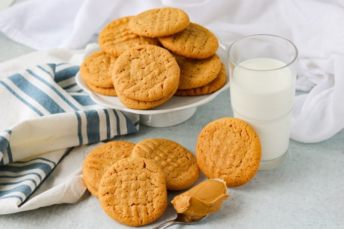 a pie plate full of peanut butter cookies.