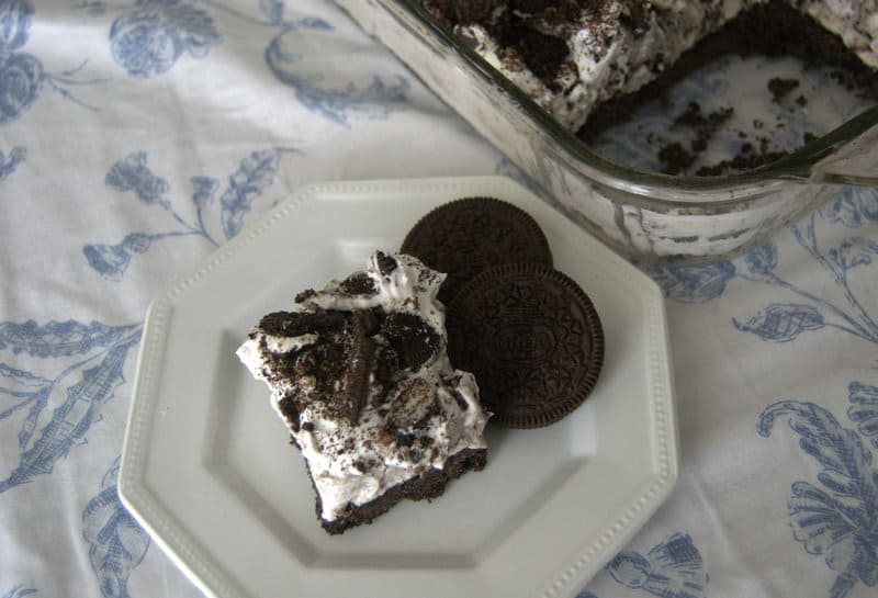 Oreo Cookie Bars - an Oreo cookie crust, covered with layers of cream cheese, Cool Whip, Oreo pudding, and crushed Oreo cookies. Does it get any better?