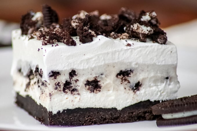 A slice of Oreo Pudding Dream Bars or Cookies and Cream Bars close up.