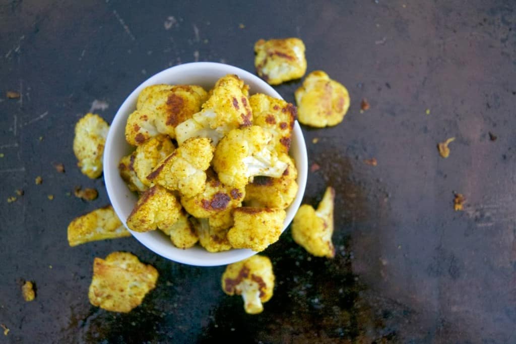 Roasted Curry Cajun Cauliflower - seasoned with curry and Cajun spices giving it a South Asian flavor with a kick of Louisiana flair.