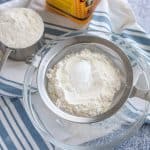 Sifting flour and corn starch together.