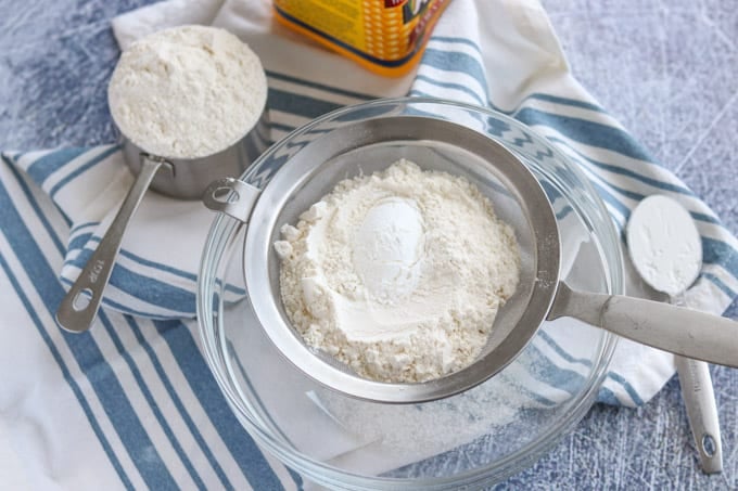 Sifting flour and corn starch together.