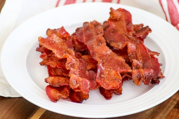 Perfectly cooked bacon on a plate.