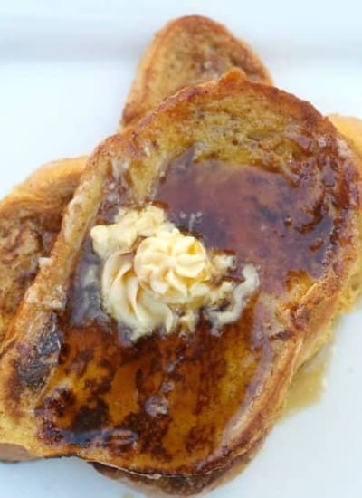 Eggnog French Toast - Challah bread dipped in an eggnog batter, browned to perfection and topped with homemade Maple Butter