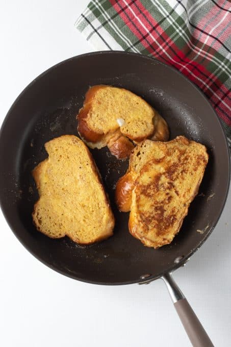 Cooking French toast in a skillet.