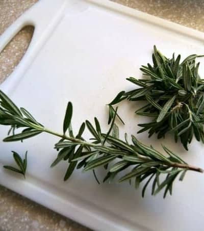 Removing fresh herbs like rosemary and thyme from their stems is easy with this little trick!