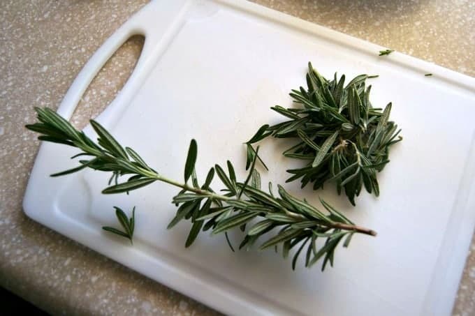 Removing fresh herbs like rosemary and thyme from their stems is easy with this little trick!