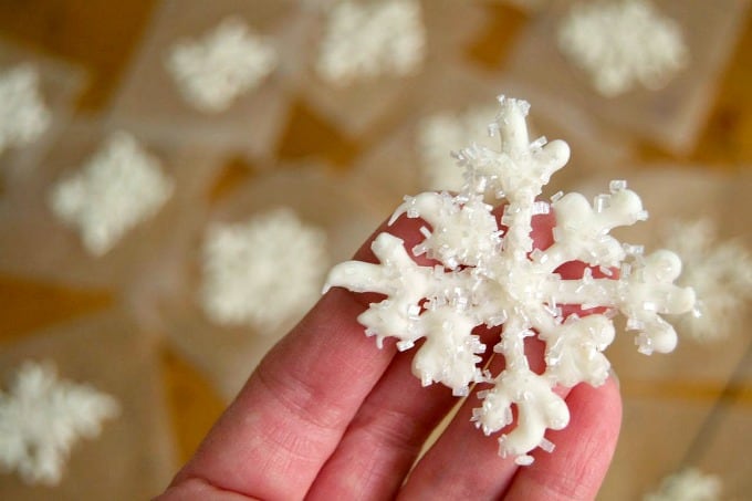 Melted white chocolate piped into the shape of a snowflake and sprinkled with shimmer white sugar. These make adorable cupcake and cake toppers!