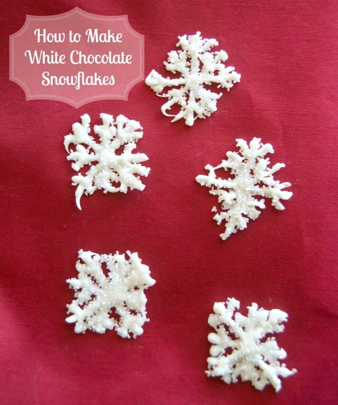 Melted white chocolate piped into the shape of a snowflake and sprinkled with shimmer white sugar. These make adorable cupcake and cake toppers!