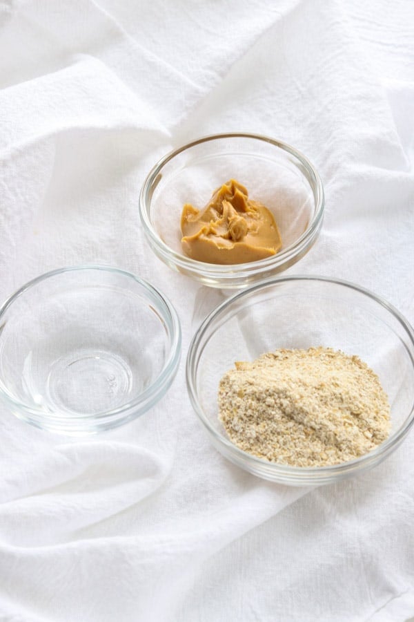 Water, creamy peanut butter, and ground oats are the ingredients for Homemade Dog Pill Pockets.