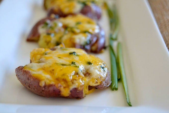 Smashed Roasted Cheesy Potatoes - roasted ruby gold potatoes smashed, seasoned and topped with Cheddar-Monterey Jack cheese to make an awesome side dish!