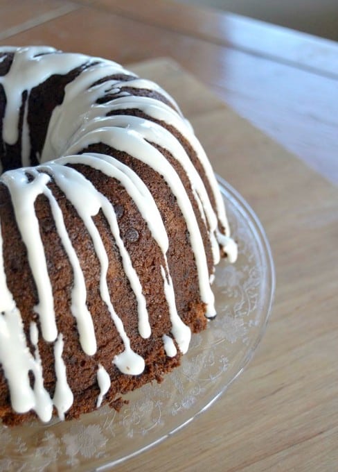 A moist delicious banana bundt cake filled with mini chocolate chips and drizzled with a cream cheese frosting!