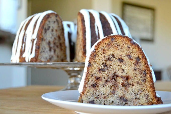 A moist delicious banana bundt cake filled with mini chocolate chips and drizzled with a cream cheese frosting!