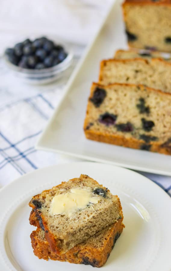 Buttered banana bread with blueberries.