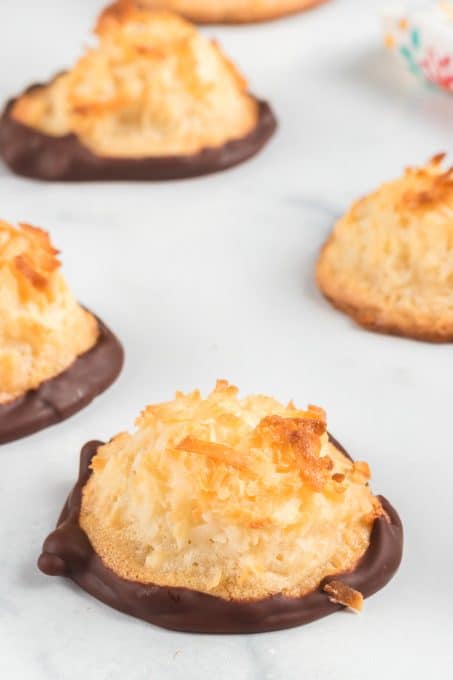 Macaroons made of coconut and dipped in chcoolate.