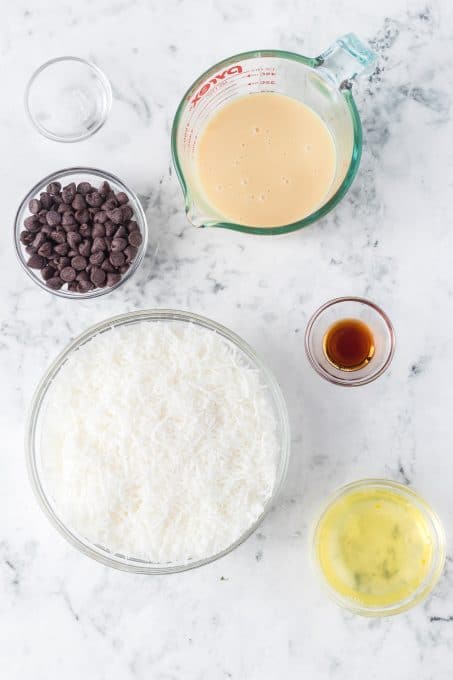 Ingredients for cookies made of coconut and dipped in chocolate.