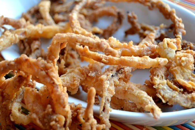 Thin slices of onion, soaked in buttermilk dipped in a spiced flour and fried to perfection.