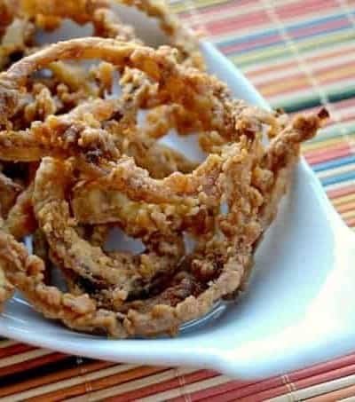 Thin slices of onion, soaked in buttermilk dipped in a spiced flour and fried to perfection.