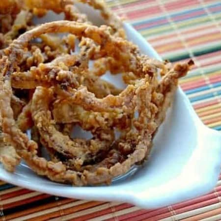 Thin slices of onion, soaked in buttermilk dipped in a spiced flour and fried to perfection.