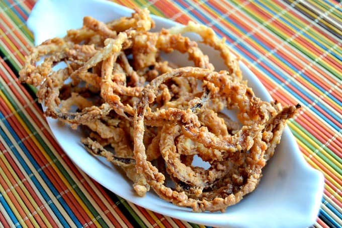 Thin slices of onion, soaked in buttermilk dipped in a spiced flour and fried to perfection.