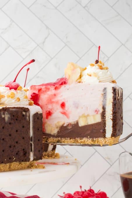 Ice cream sandwiches, chocolate and strawberry ice cream with pineapple, whipped cream, nuts and cherries.