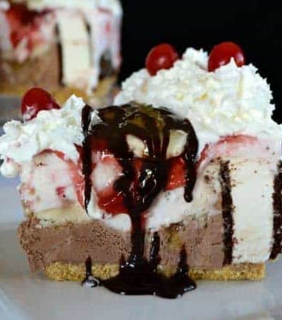 Layers of chocolate and strawberry ice cream, ice cream sandwiches, bananas, chocolate, pineapple and strawberry sundae toppings, and of course, whipped cream and cherries! WOW!