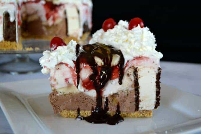 Layers of chocolate and strawberry ice cream, ice cream sandwiches, bananas, chocolate, pineapple and strawberry sundae toppings, and of course, whipped cream and cherries! WOW!