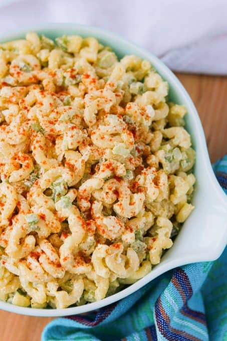 A bowl full of salad made with elbow macaroni.
