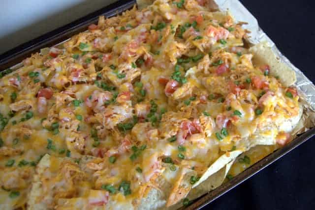 The old chicken nachos picture. Nachos loaded with BBQ Chicken, tomatoes, green onions and lots of cheese!