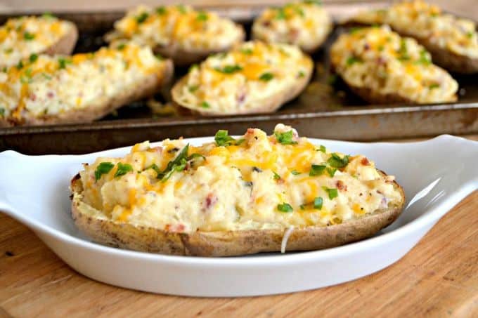 These Twice Baked Potatoes are baked then mixed with cream cheese, Greek yogurt, Old Bay Seasoning and bacon. They'll complement your meat dish very well!