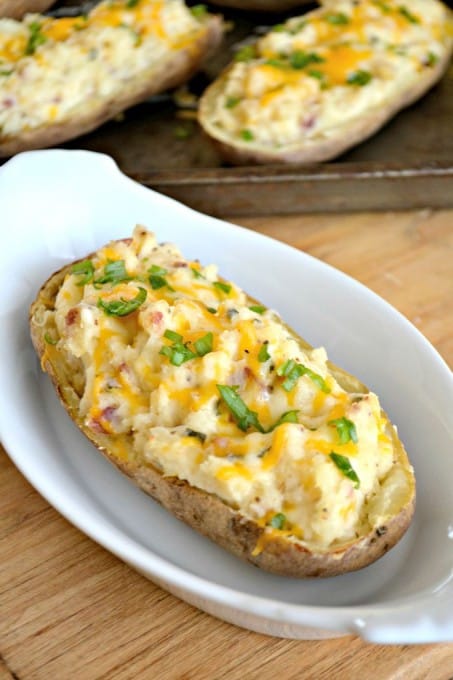 These Twice Baked Potatoes are baked then mixed with cream cheese, Greek yogurt, Old Bay Seasoning and bacon. They'll complement your meat dish very well!