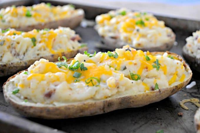 These Twice Baked Potatoes are baked then mixed with cream cheese, Greek yogurt, Old Bay Seasoning and bacon. They'll complement your meat dish very well!