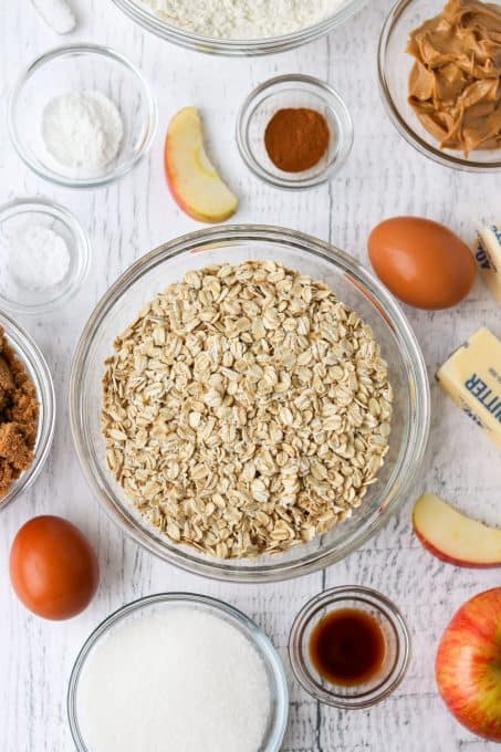 Ingredients for oatmeal cookies with apple and peanut butter.