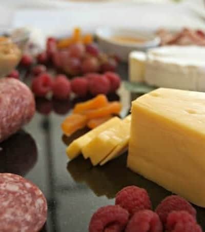 Creating a colorful, appealing and tasty cheese board for entertaining is easy with these ingredients!