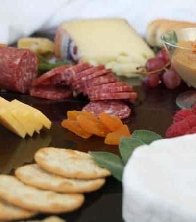 Creating a colorful, appealing and tasty cheese board for entertaining is easy with these ingredients!