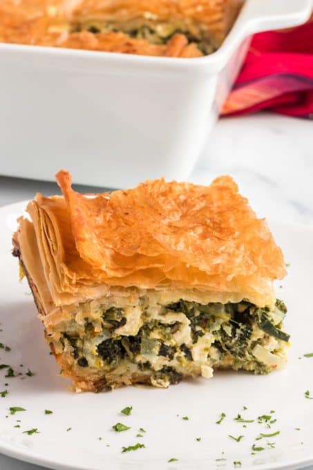Spinach, eggs, and feta cheese packed in between layers of phyllo dough.