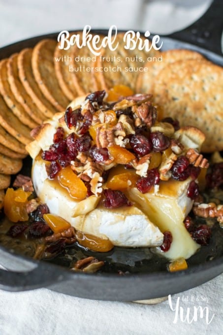 Baked Brie with dried fruits, nuts, and butterscotch sauce- a great holiday appetizer