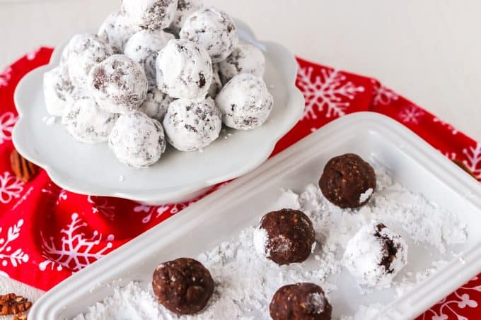 Rolling chocolate balls in powdered sugar.